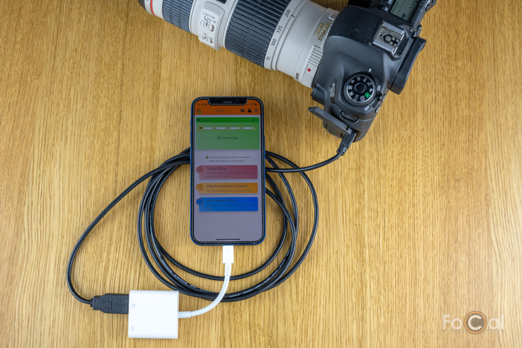 Reikan FoCal Mobile connected to a Canon EOS 6D, showing the Apple Lightning to USB3 Camera Adapter.