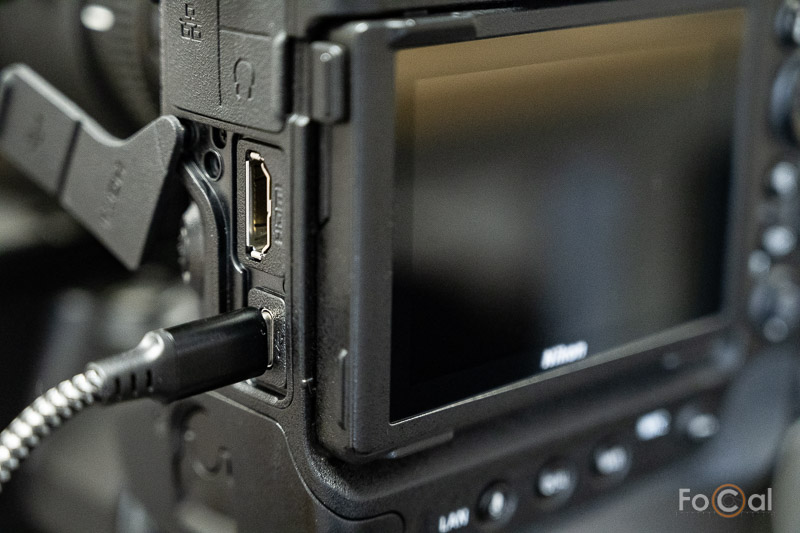 A photo of the back of a Nikon mirrorless camera connected via USB to Reikan FoCal